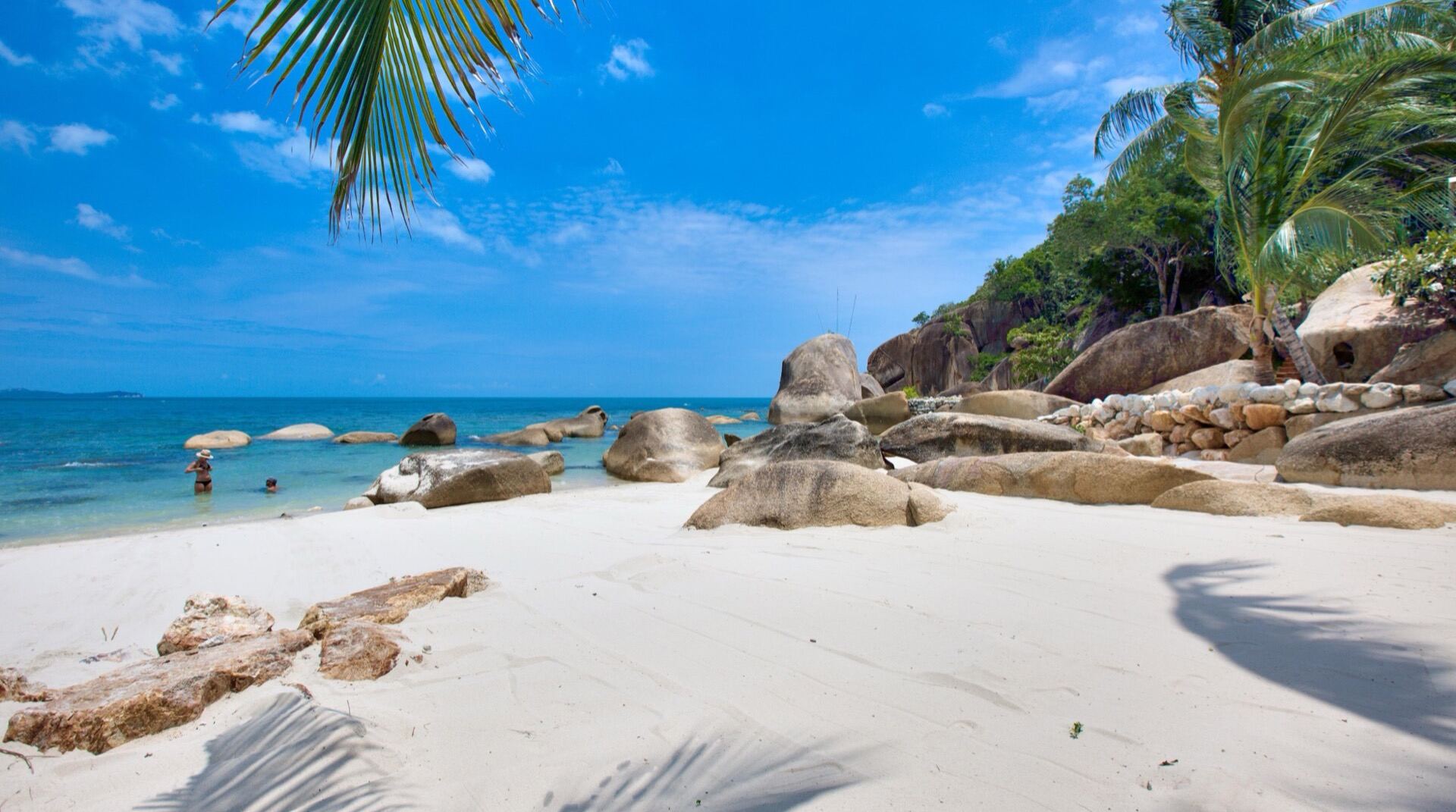 Crystal Bay wide panoramic view with granite boulders and clear water
